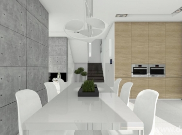 Nowoczesna kuchnia w loftowym stylu, z efektownym betonem architektonicznym na ścianach, połączona z jadalnią i salonem w domu energooszczędnym z poddaszem.