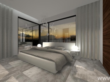 Minimalistyczna sypialnia, urządzona w modnych szarościach, znajdująca się na poddaszu domu energooszczędnego o bardzo nowoczesnej architekturze.
