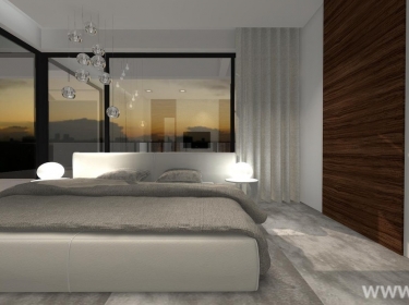 Minimalistyczna sypialnia, urządzona w modnych szarościach, znajdująca się na poddaszu domu energooszczędnego o bardzo nowoczesnej architekturze.